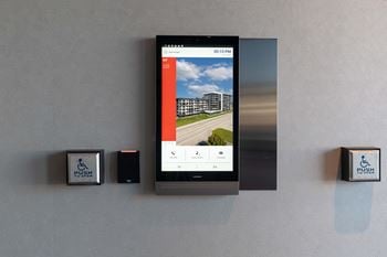 A wall-mounted device displays